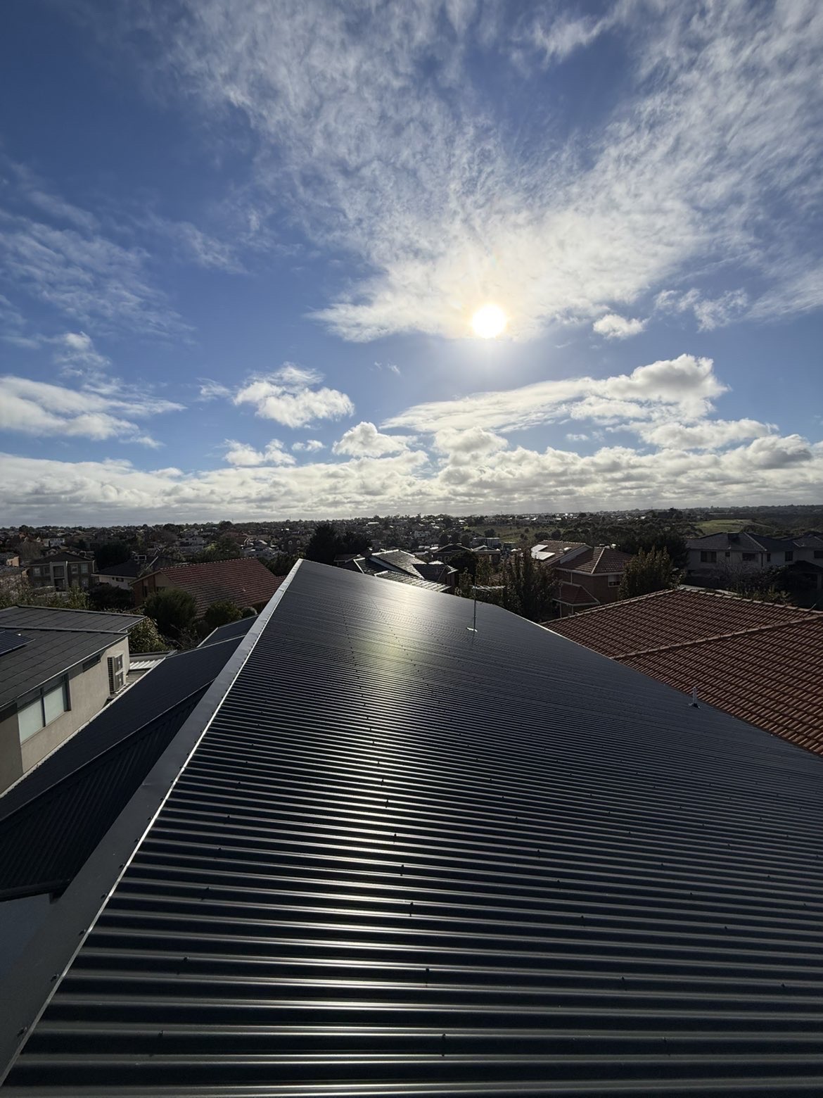 Black metal roof installation on a Melbourne home