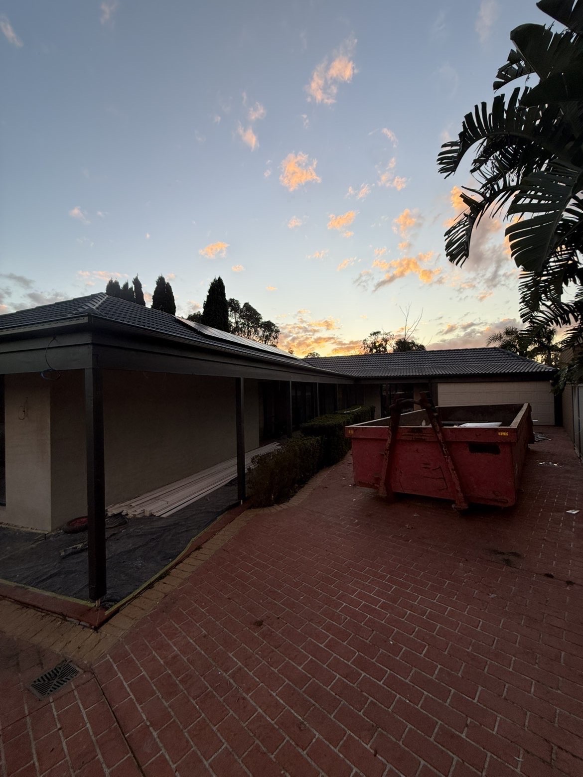 Wider view of a completed patio roofing project