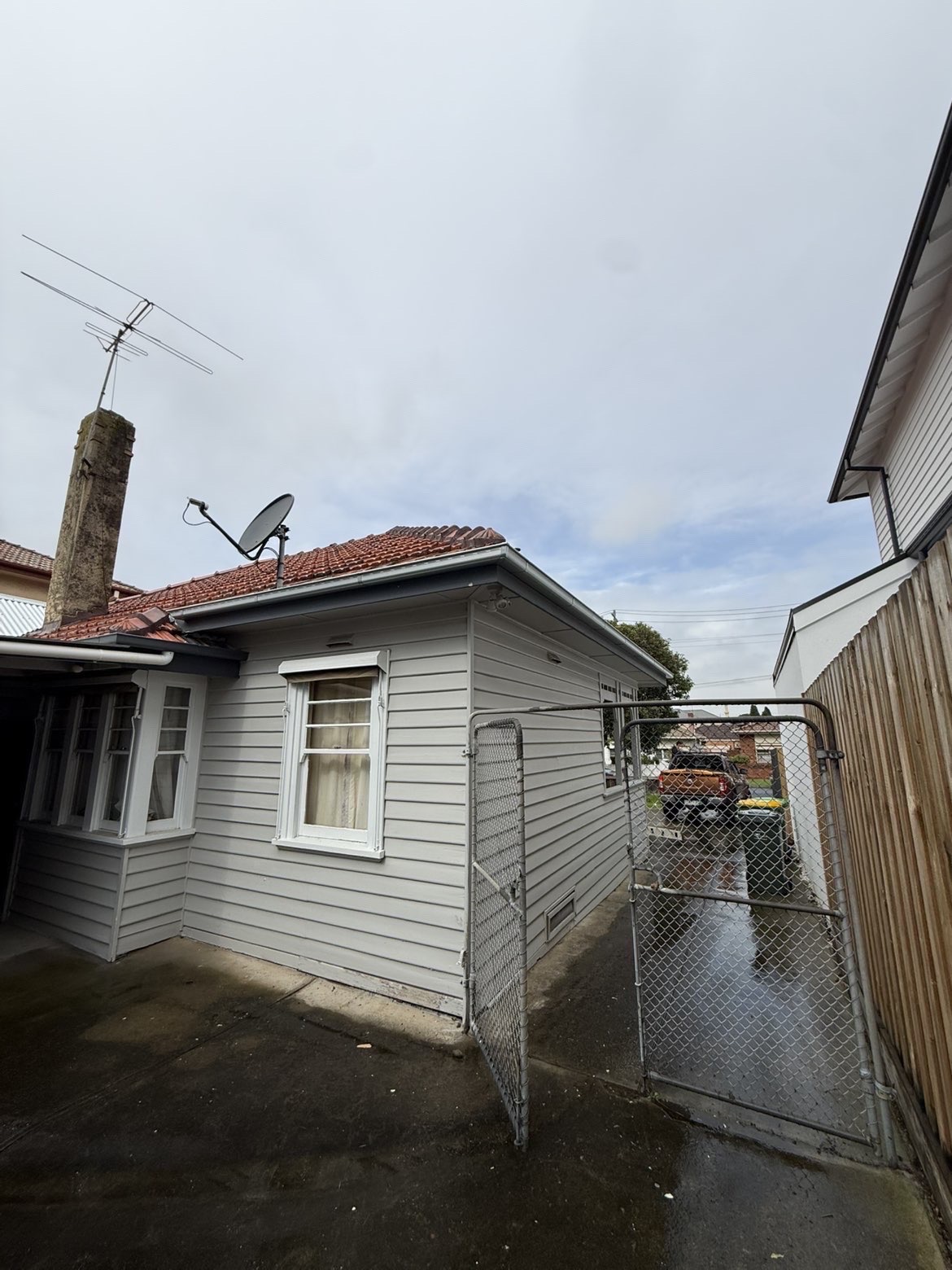 Side elevation of a weatherboard home with a tiled roof